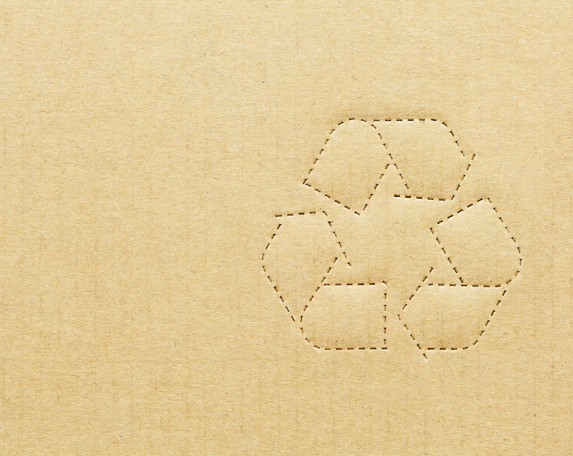 plant based packaging — Recycling symbol on tan cardboard box