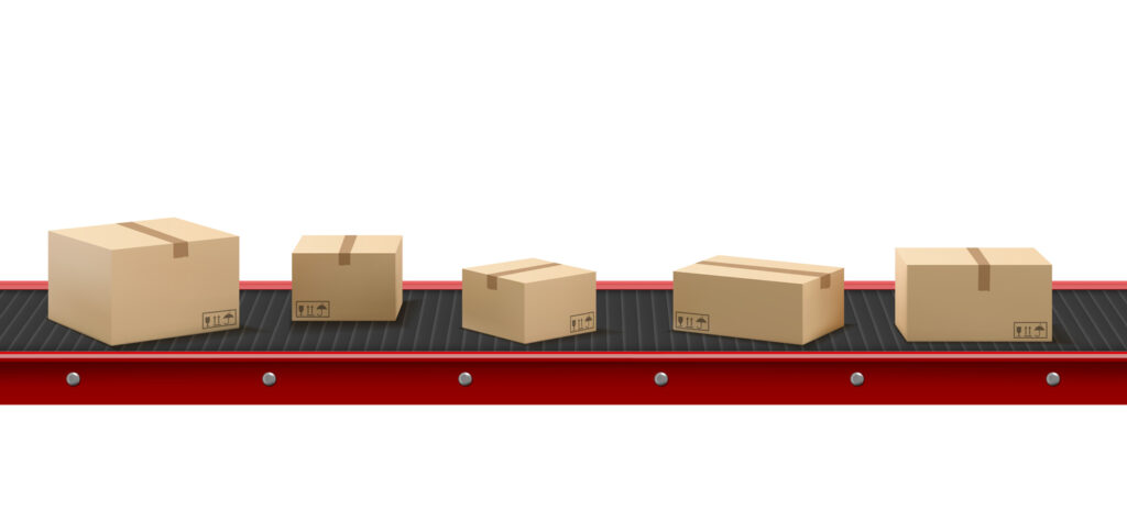 industrial shipping boxes — Conveyor belt with cardboard boxes at factory
